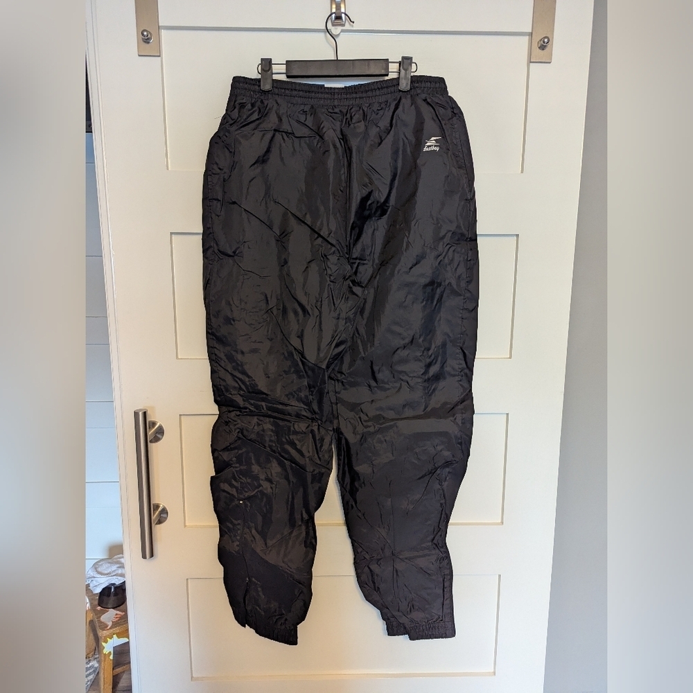 Vintage Eastbay black fleece lined wind pants with zipper ankles. Sz Large Tall.